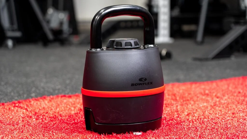 Image of the Bowflex Adjustable Kettlebell sitting on the gym floor.
