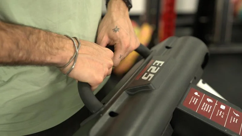 A close look at the handle for moving a Sole E25 Elliptical.
