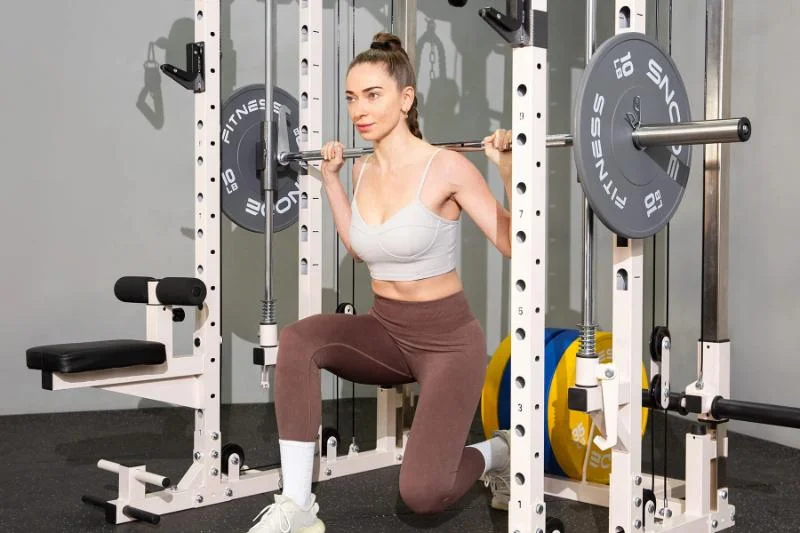 Performing lunges on the Snode All10 Pro Smith Machine