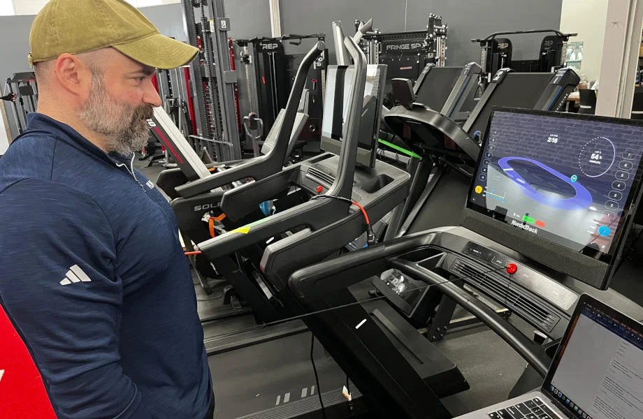 Our tester walking on a NordicTrack treadmill for testing in our equipment facility.