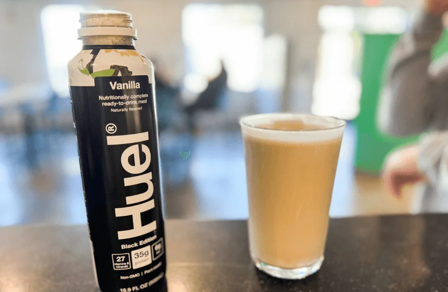 A full pint glass of Huel Ready-to-Drink meal replacement shake