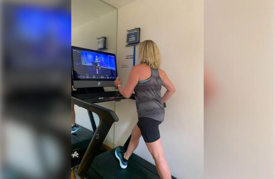 Woman walking on the Peloton Tread