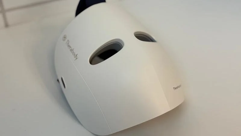 the-theraface-mask-glo The TheraFace Mask Glo sitting on a white surface.