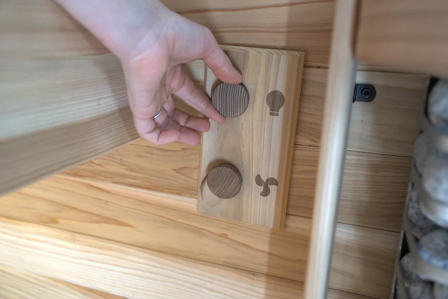 Our tester adjusts the controls in a Plunge Sauna Mini