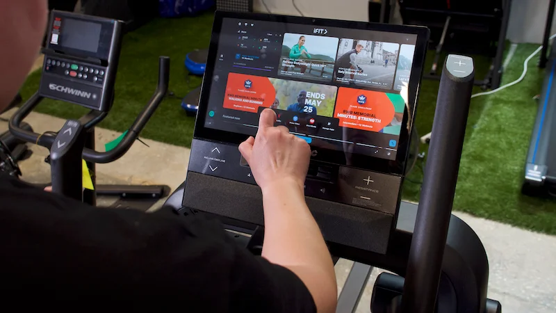 GGR Managing Editor Amanda Dvorak navigating the touchscreen display on the NordicTrack X16 Elliptical