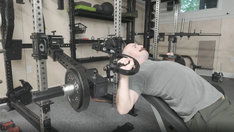 Garage Gym Reviews founder Cooper "Coop" Mitchell doing bench presses on an incline with RVL Wings.