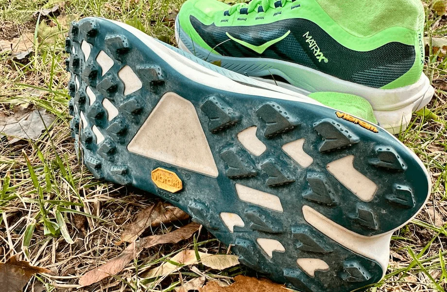 The Vibram Megagrip outsole featured on the HOKA Tecton X 3 trail running shoes