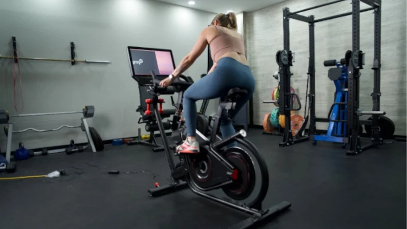 Full view of a person riding a BowFlex Velocore bike