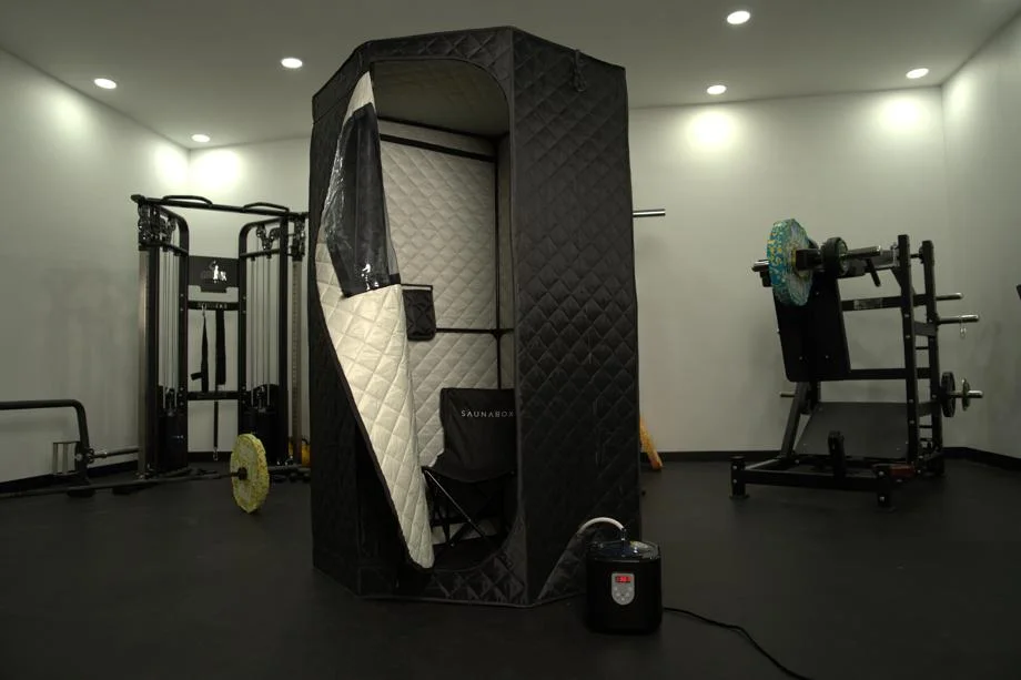 Full view of the Sauna Box SmartSteam Pro in a gym