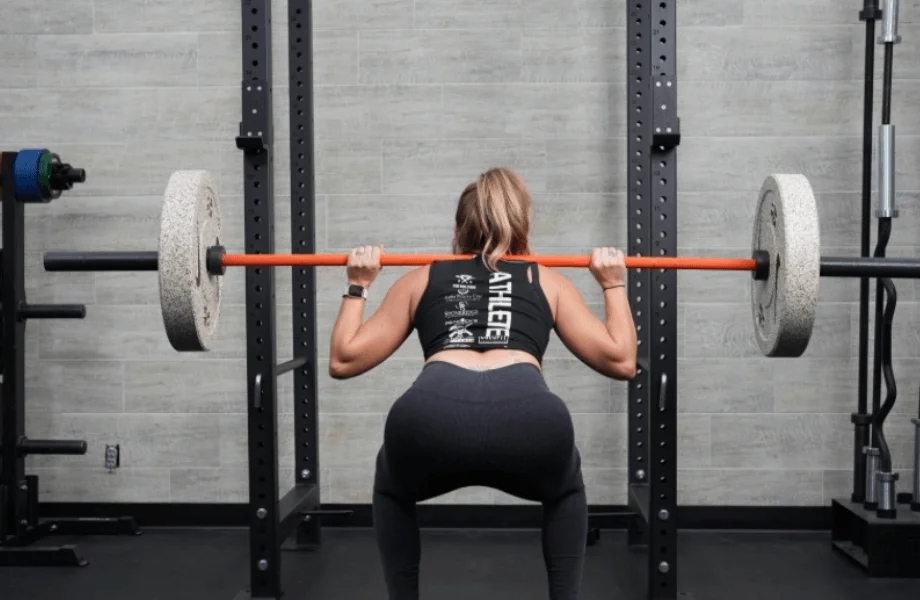 Our tester performing a back squat with Nike Grind Bumper Plates