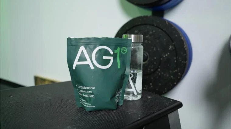 ag1 greens supplement front of bag and brand bottle