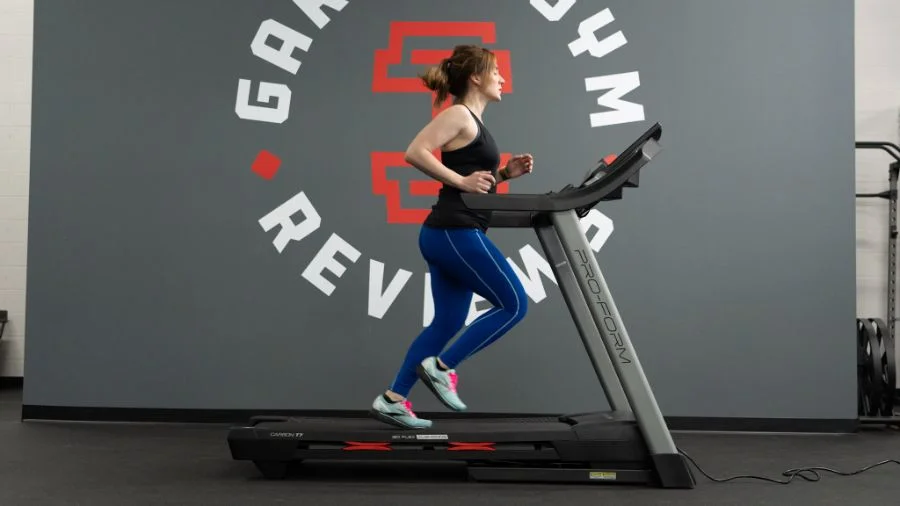 An image of a woman running on a treadmill