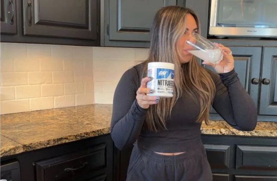 Woman drinking Nitraflex Pre-Workout