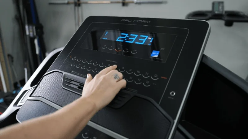 Our tester selecting a speed setting on the ProForm Carbon TLX treadmill