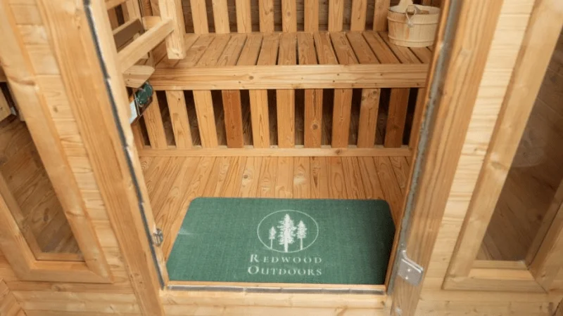 The entryway leading into the Redwood Outdoors Thermowood Cabin sauna