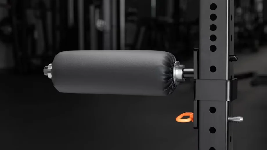 The Rogue Monster Lite Rack Mount Leg Roller attached to a squat rack