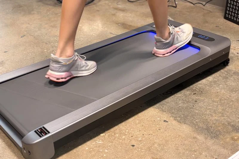 A person walking on the MERACH UltraWalk W60 Plus Walking Treadmill