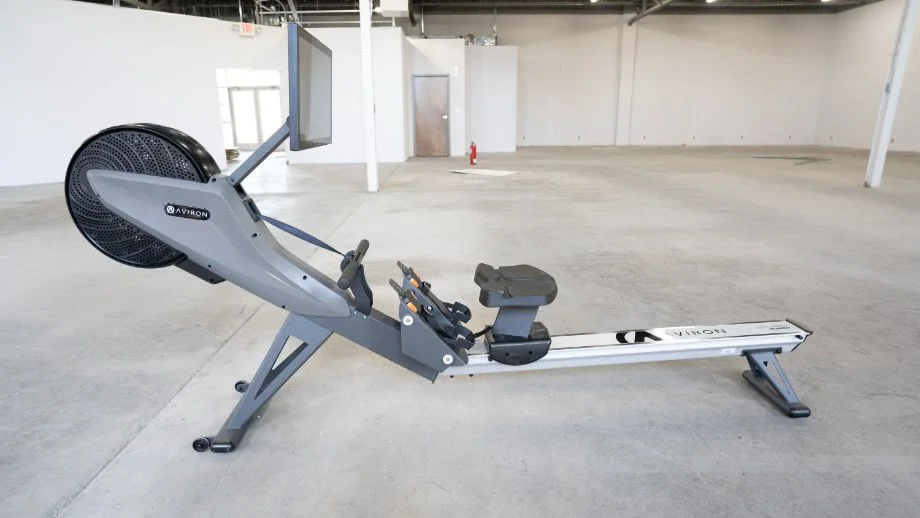 an aviron rowing machine in an empty warehouse
