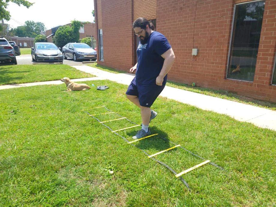 Olympian Caine Wilkes doing footwork drills with the SKLZ Quick Ladder.