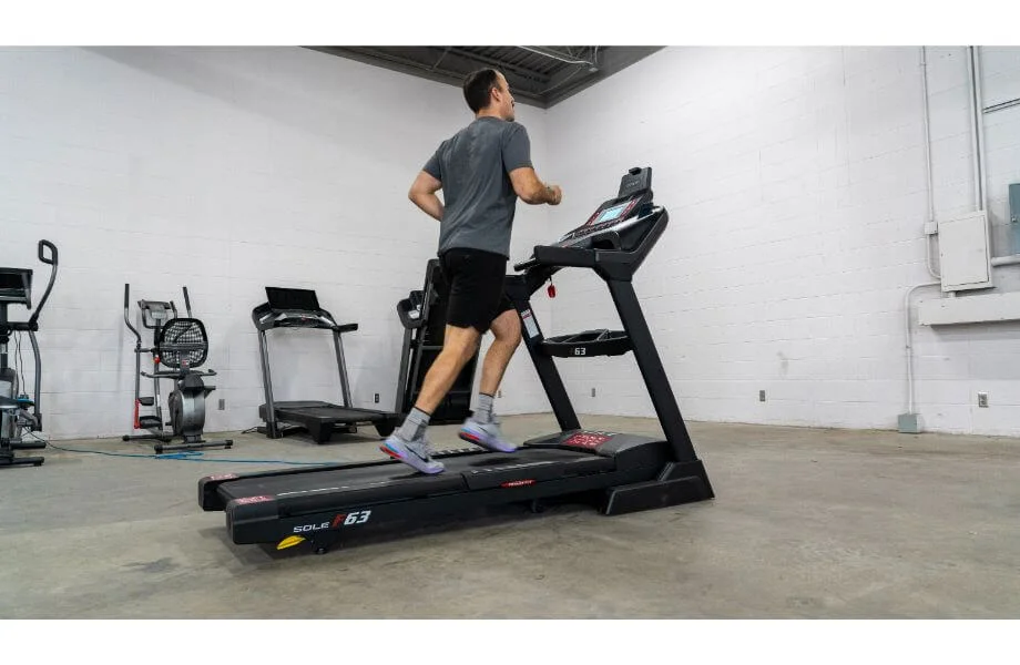 coop jogging on sole treadmill