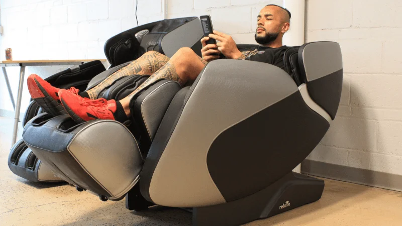 Our tester adjusting their massage settings on the Relaxe Zero-Gravity Shiatsu Massage Chair