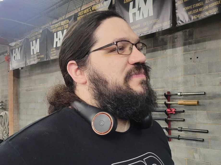 A bearded man wears the GULAKI Neck Fan