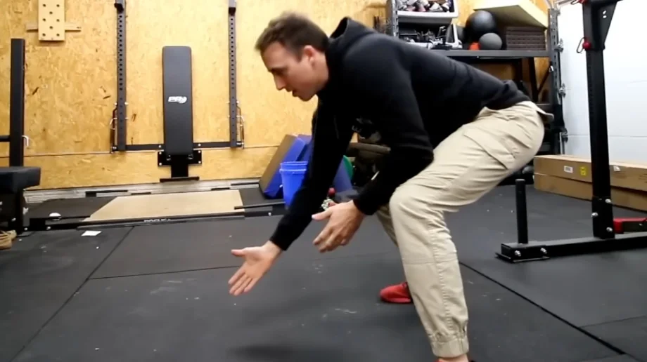 man showing stall mats