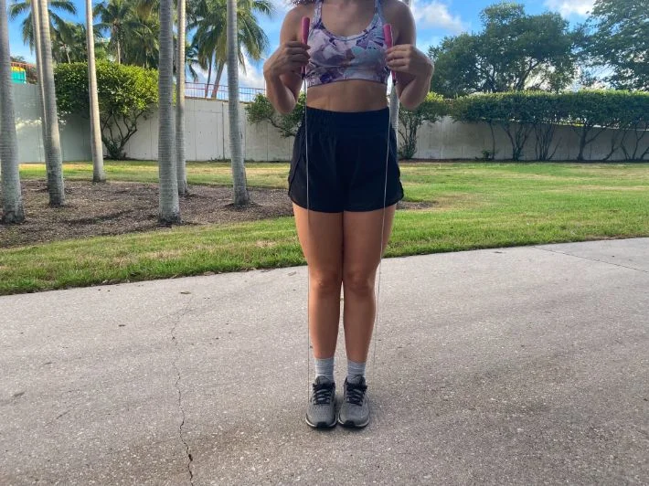 Woman sizing jump rope