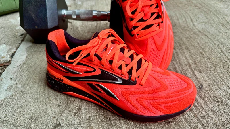 Side view of a pair of Reebok Nano X5 shoes