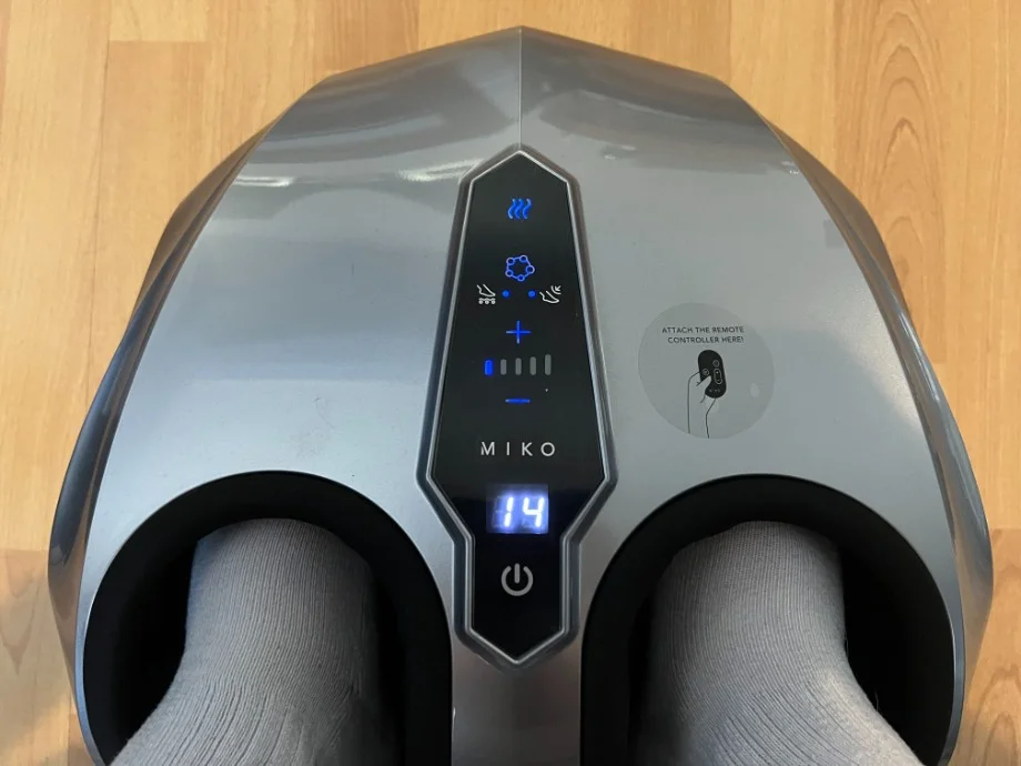 Looking down at feet inside a MIKO Foot Massager