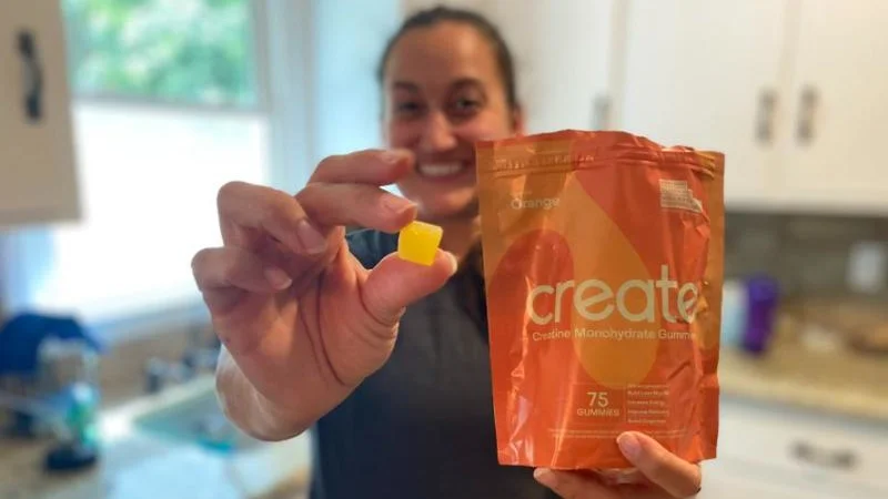 Our tester holds up some Create Creatine Gummies