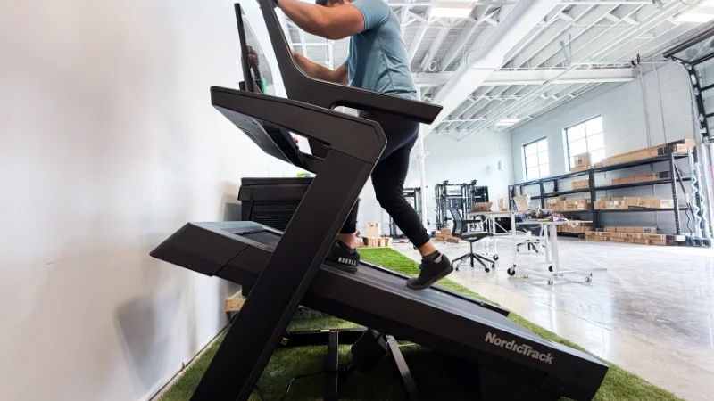 Our tester demonstrating the incline capability of the NordicTrack X24 treadmill