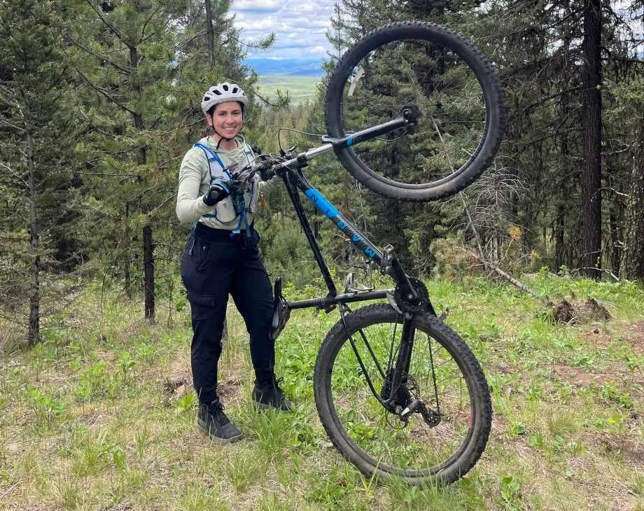 Amanda Capritto poses in the forest with an upright Marin Bobcat Trail 3