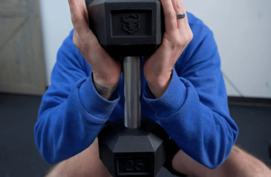 Our tester performing a goblet squat with an Iron Bull Rubber Hex Dumbbell