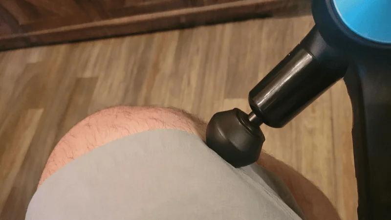 ggr-theragun-pro-tester-showcasing-contact-area-around-knee Our tester using the Therabody Theragun Pro with its standard ball attachment