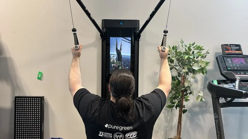 Olympian Caine Wilkes working out on the Tonal 2 Smart Home Gym.