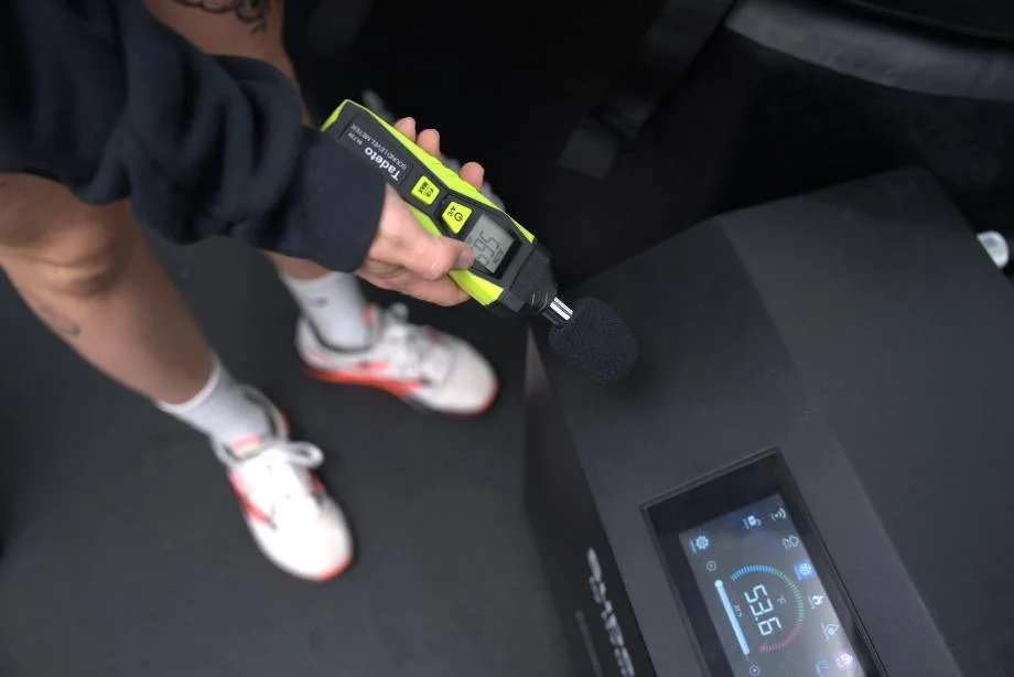 Lindsay tests the Hydragun Supertub Cold Plunge with a decibal meter.