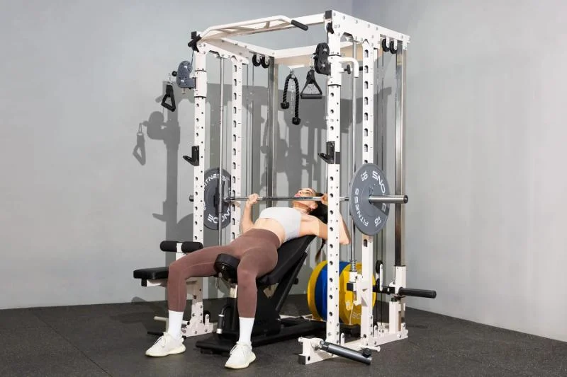 Performing bench press on the Snode All10 Pro Smith Machine