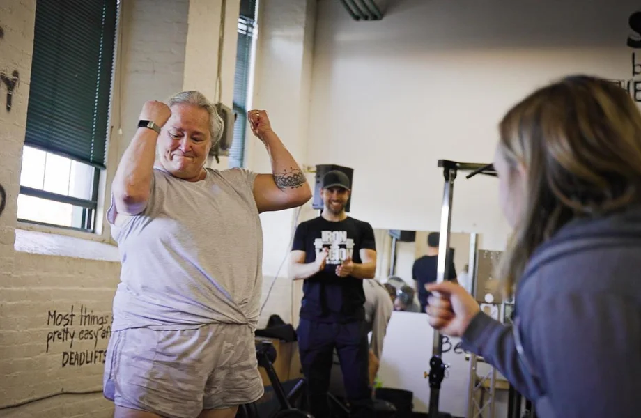 Female coach fist bump client