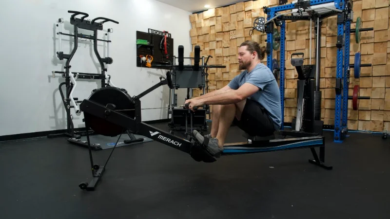 A person using the MERACH NovaRow R50