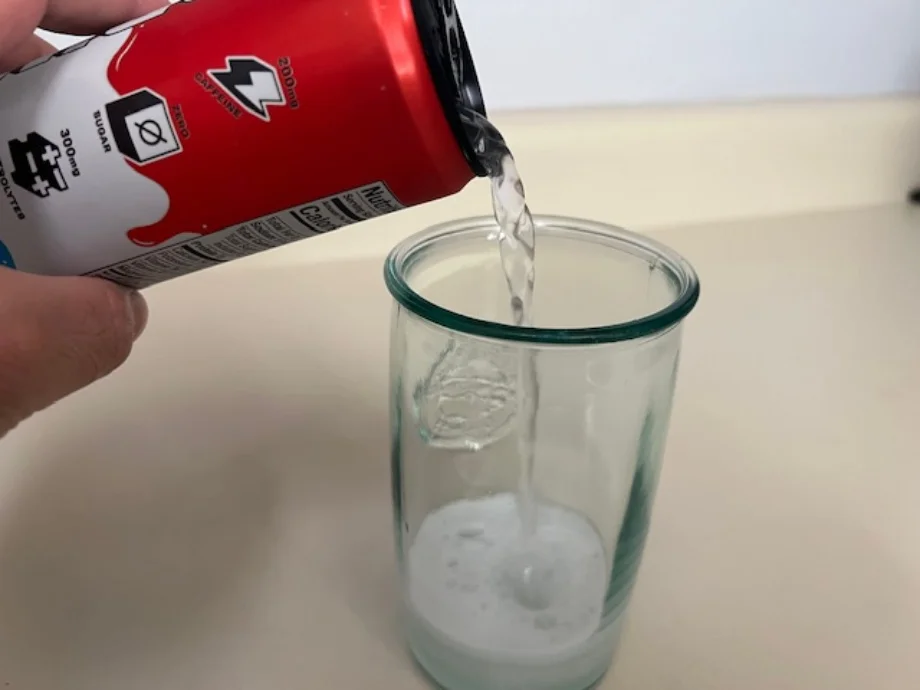 Pouring a PRIME Energy drink into a glass