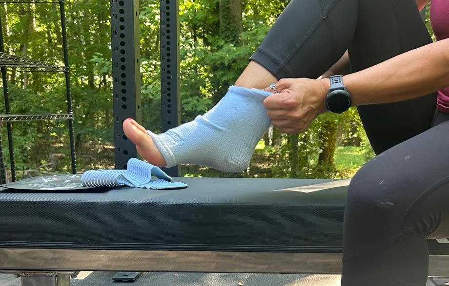 Our tester putting on a Sleeve Stars Ankle Brace