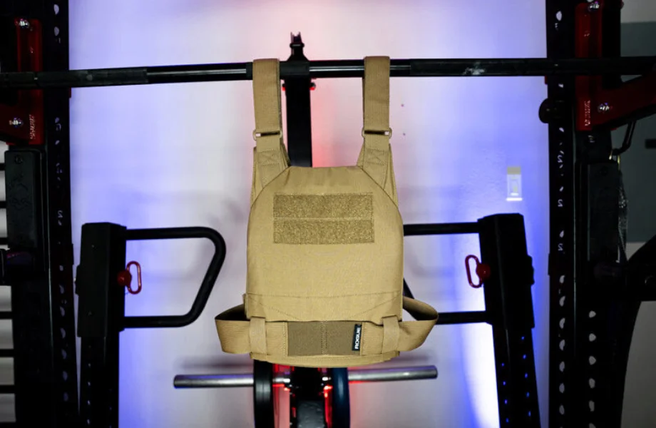 The Rogue Fitness Plate Carrier hanging on a barbell