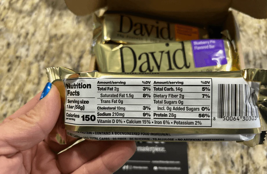 Our tester reading the nutrition facts of a David protein bar