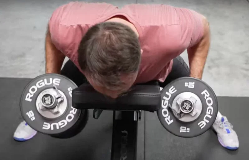 Coop performing chest-supported rows with the Rogue Loadable Dumbbells