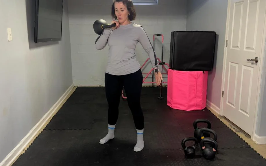 Our tester Nicole Davis, CPT, PN1-NC, working out with a Kettlebell Kings Kettlebell.