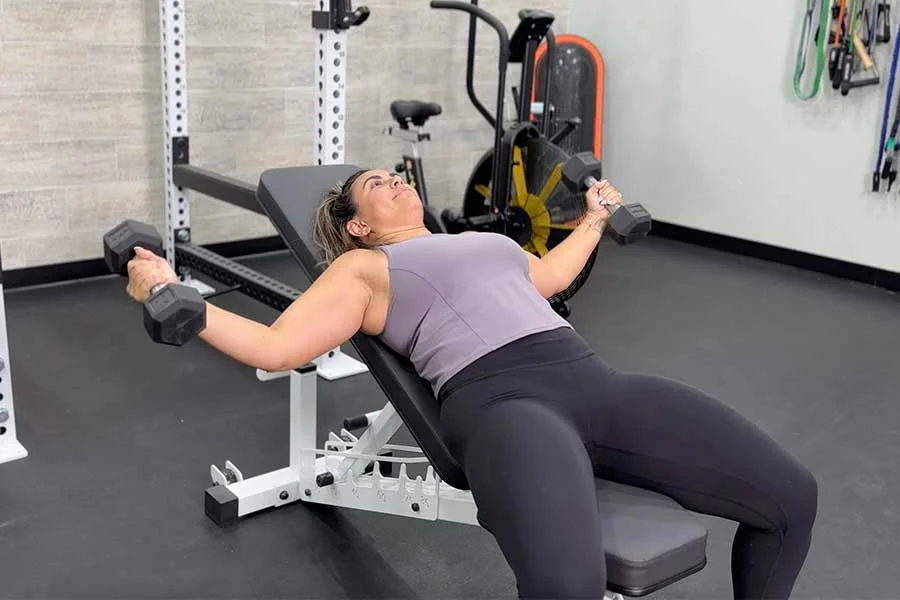 Woman performing an incline chest fly