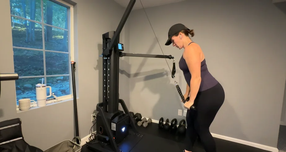 Woman doing triceps pulldown on FitTransformer Titan